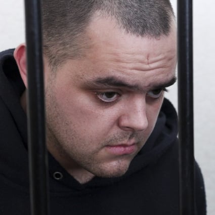 British citizen Aiden Aslin behind bars in a courtroom in Donetsk, in the territory which is under the Government of the Donetsk People’s Republic control, eastern Ukraine. Photo: AP