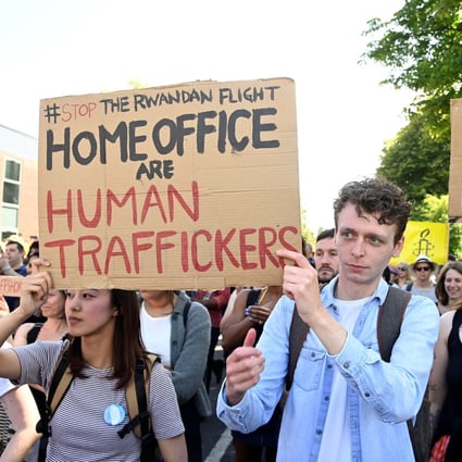 Demonstrators protest outside the UK’s Gatwick Airport on Sunday against a planned deportation of asylum seekers from Britain to Rwanda. Photo: Reuters 