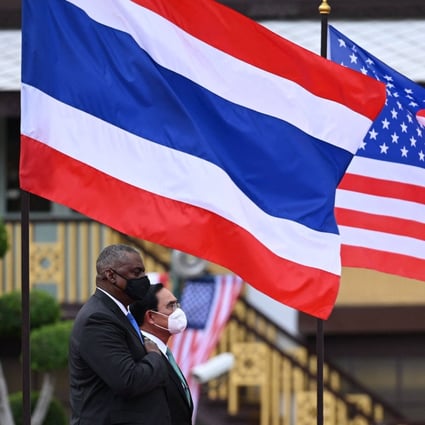 US Defence Secretary Lloyd Austin, left, stands at attention beside Thailand’s Prime Minister Prayuth Chan-ocha as they inspect an honour guard at Government House in Bangkok on Monday. Photo: AFP