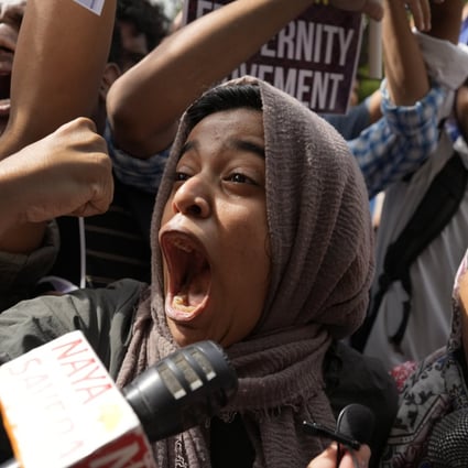 Muslim students shout anti-government slogans during a protest in New Delhi on Monday against the persecution of Muslims in India. Photo: AP