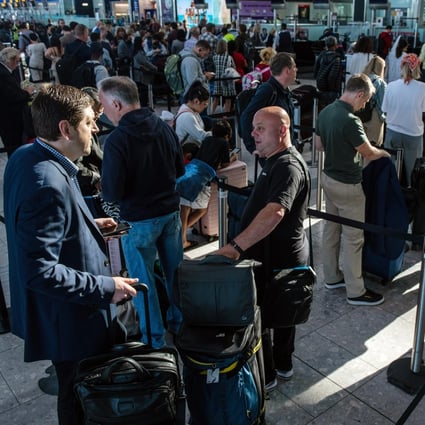Passengers queue to check in at the departures hall of Terminal 5 at London Heathrow Airport in London, UK, on Monday, June 13, 2022. Long queues have become a feature at airports this year. Photo: Bloomberg
