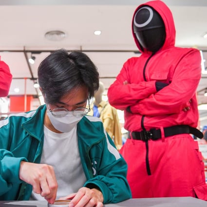 A man takes part in a “Squid Game” mission at a department store in Bangkok, Thailand in November 2021. Photo: Reuters