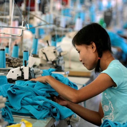 A Myanmar migrant works in a Taiwanese-owned garment factory in Thailand. Photo: Reuters