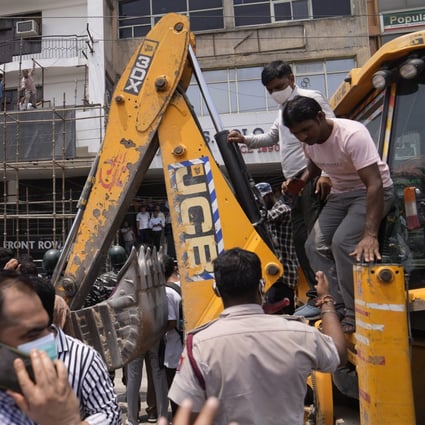 Protests have been erupting in many Indian cities to condemn the demolition of homes and businesses belonging to Muslims, in what critics call a growing pattern of “bulldozer justice” aimed at punishing activists from the minority group. Photo: AP