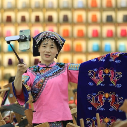 A woman promotes traditional tapestry weaving in a live stream. Tencent is betting big on live-streaming e-commerce through WeChat Channels, a video platform. Photo: Xinhua