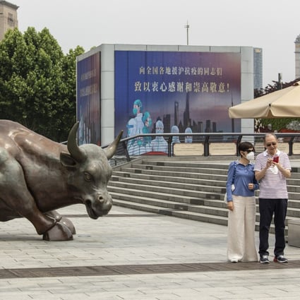 The Bund Bull statue and a screen displaying a thank you message for healthcare workers in Shanghai on June 1 as the city emerges from a lockdown. Photo: Bloomberg