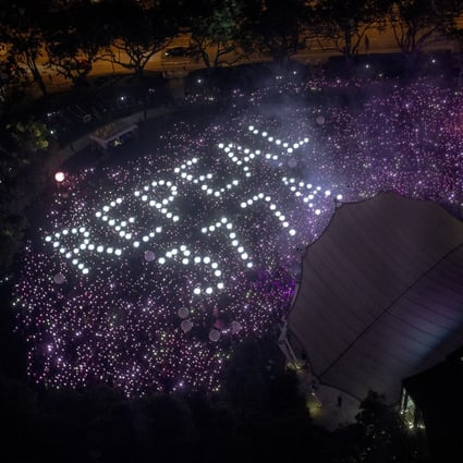 The words ‘Repeal 377A’ referencing a law that criminalises gay sex in Singapore are seen at the 2019 Pink Dot event in Hong Lim Park. Photo: EPA-EFE