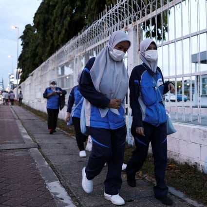 Workers return home from an electrical and electronics industrial zone at Sungei Way Free Trade Zone, in Petaling Jaya, Selangor, on June 10. Labour productivity growth has averaged 1.1 per cent in Malaysia in the past five years. Photo: Reuters 