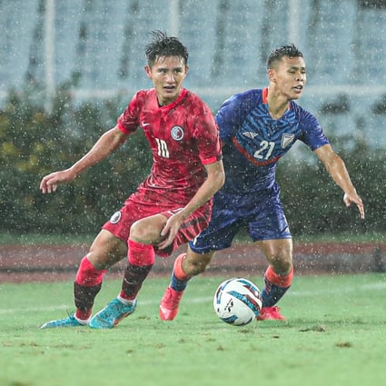 Hong Kong’s Wong Wai (left) and India midfielder Suresh Sing Wangjam battle for the ball at Salt Lake Stadium in Kolkata, India, during their last Group D Asian Cup qualifier. Photo: HKFA