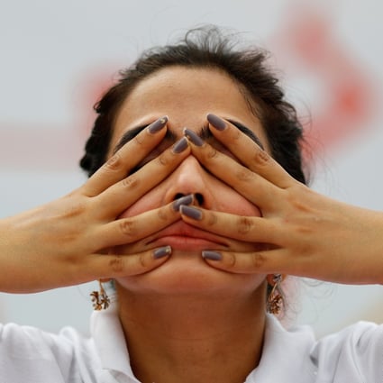 Amid social distancing during the Covid-19 pandemic, in the old quarters of Delhi, India, a participant still performed yoga during World Yoga Day in 2021. Photo: Reuters