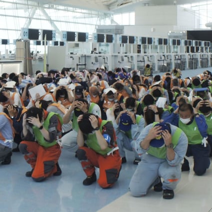 A disaster drill is conducted at Tokyo’s Haneda airport last month, as a massive earthquake may hit Tokyo in the future. Japan’s west coast was jolted by a 5.2 magnitude quake on Sunday. File photo: Kyodo