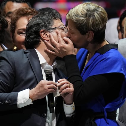Veronica Alcocer kisses her husband, President elect Gustavo Petro, as they celebrate with supporters in Bogota, Colombia. Photo: AP