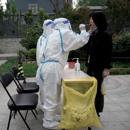 A person has a Covid-19 test taken in Beijing in April. China is drifting apart from the rest of the world due to its hardline pandemic restrictions, European ambassadors say. Photo: AFP