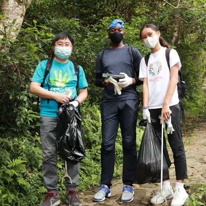 Faith Hui (right) and other volunteers help clear trash from the Little Hawaii Trail in Hong Kong during Serve-a-thon, an annual community-service week run by local volunteer charity HandsOn. Photo: HandsOn Hong Kong