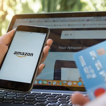 An iPhone 6s showing Amazon logo and credit card for shopping online. Photo: Shutterstock Images