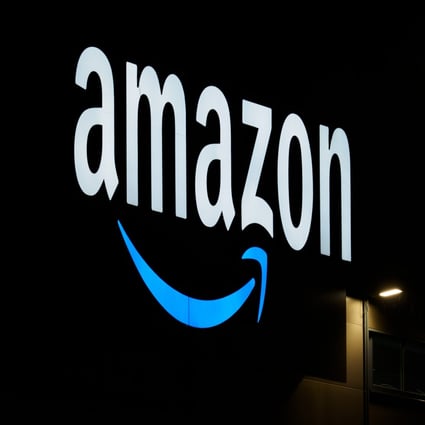 The Amazon logo is seen on the facade of a sorting centre. Photo: dpa