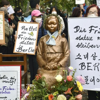 People gather around a statue symbolising Korean “comfort women” made to work in Japanese wartime military brothels, in Berlin in 2020, in protest against the German city’s decision to rescind approval for it to stand there. The authorities later changed their stance and the statue is still in place. Photo: Kyodo