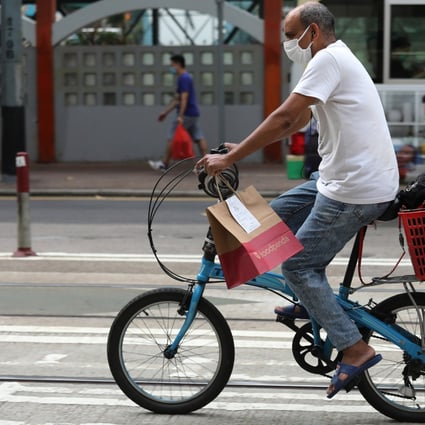 A delivery worker rides through Wan Chai on July 15, 2020. Photo: Nora Tam