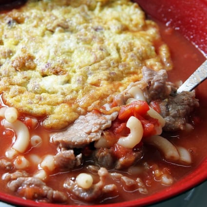 Tomato broth macaroni with luncheon meat and fried egg at Sing Heung Yuen  in Central - a place that food marketer Deanna Chuang says visitors to the city simply have to visit. Photo: SCMP