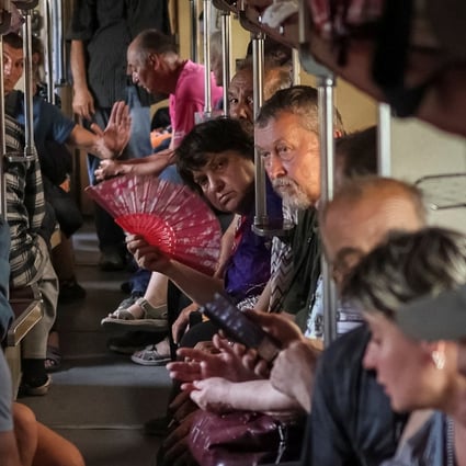 People sit on a train to Dnipro and Lviv during an evacuation effort from war-affected areas of eastern Ukraine on June 18. Photo: Reuters