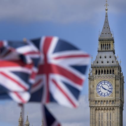 Union Jack flags are seen in front of the Elizabeth Tower, known as Big Ben, beside the Houses of Parliament in London. Photo: AP 