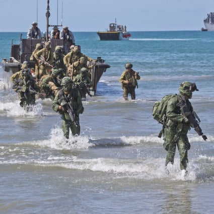 Australian soldiers disembark from a landing craft during a military training exercise with their Singapore counterparts in 2014. Photo: Australian Department of Defence Handout
