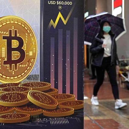 An ad for bitcoin is displayed on a street in Hong Kong. Photo: AP 
