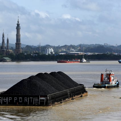 A tug boat pulls a coal barge along a river in East Kalimantan province. Was Indonesia’s powerful coal lobby behind the country’s recent ban on renewable-energy exports? Photo: Reuters