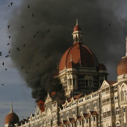 The Taj Hotel burns from an attack that killed multiple people in Mumbai, on November 27, 2008. File photo: AP