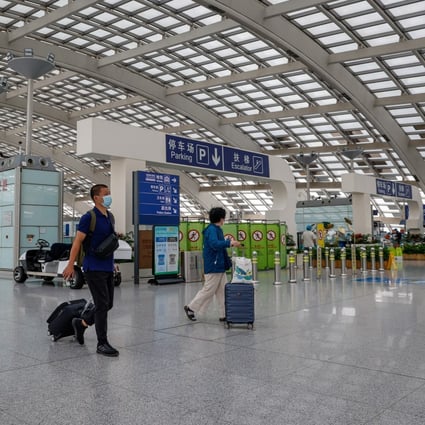 Travellers arrive at Beijing Capital International Airport on June 29, a day after China cut its quarantine period for overseas arrivals. Photo: EPA-EFE