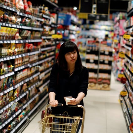 A customer browses supermarket shelves in Bangkok. Global food prices are surging. Photo: Reuters