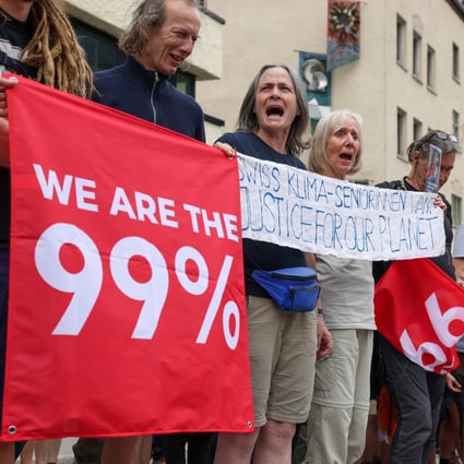 Protesters in Davos, Switzerland, on May 22 ahead of the annual WEF meeting. Better public-private coordination is needed to tackle collosal challenges, ranging from climate change and pandemic preparation to infrastructure shortages and supply chain repair. Photo: Bloomberg