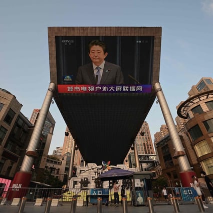 A video screen in Beijing shows news of former Japanese prime minister Shinzo Abe. Photo: AFP