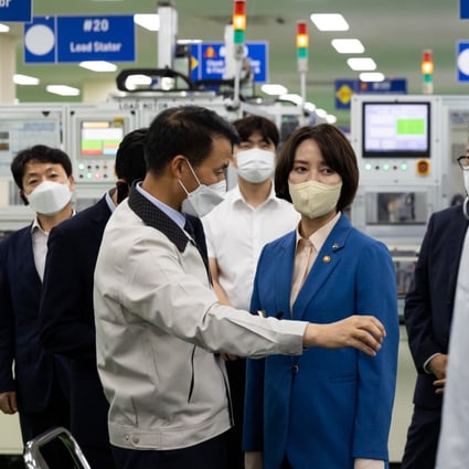 Lee Young, South Korea’s small and medium-sized enterprise and startups minister (left), looks at the production line of Shift By Wire motors for vehicles during a media tour at the Samhyun factory in Changwon. Photo: Bloomberg
