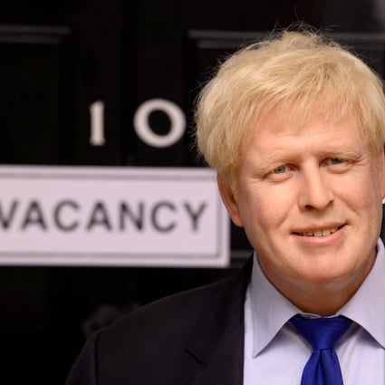 A wax figure of British Prime Minister Boris Johnson is pictured next to a “vacancy” sign on 10 Downing Street at Madame Tussauds in London on July 7. Photo: Madame Tussauds London via Reuters