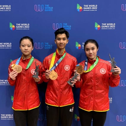 Wushu athletes Michelle Yung (right), Yeung Chung-hei and Lee Wing-yung (left) with their bronze medals. Photo: Hong Kong Wushu Union