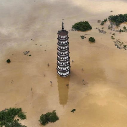 Wenfeng Tower is submerged in flood water after torrential rains on June 22, 2022, in Qingyuan, in China’s Guangdong province. Photo: Getty