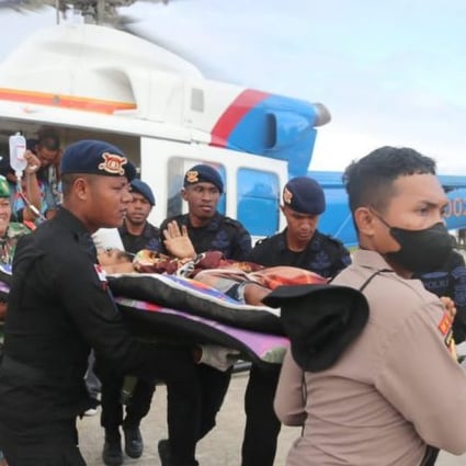 Military and police officers in Indonesia’s Papua evacuate victims of a fatal shooting on Saturday believed to have been carried out by a separatist group. Photo: Twitter