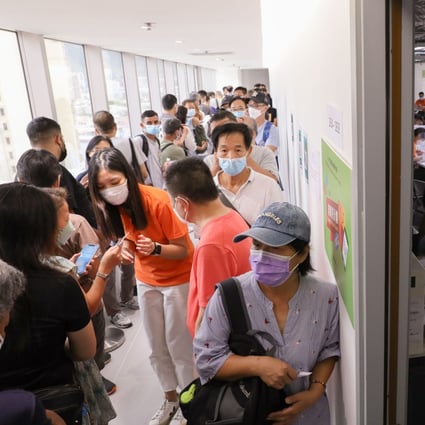 Residents queue up at the consumption voucher service centre in Mong Kok on Friday after learning they are not eligible for the second tranche of e-coupons. Photo: Yik Yeung-man