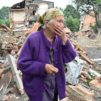 An elderly resident surveys the aftermath of shelling in the city of Chuguiv, east of Kharkiv, Ukraine. Photo: AFP