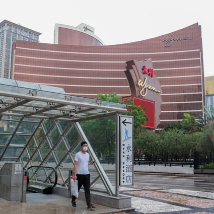 A man walks outside the Wynn Macau casino resort amid the Covid-19 outbreak, in Macau on July 4, 2022. Poor gaming earnings pulled down casino stock in Hong Kong on Tuesday. Photo: Reuters