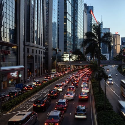 Vehicles travel along a road in Hong Kong. Experts say new data regulations in China, which will come into effect next month, could affect the city’s role as a business gateway to the mainland. Photo: Bloomberg