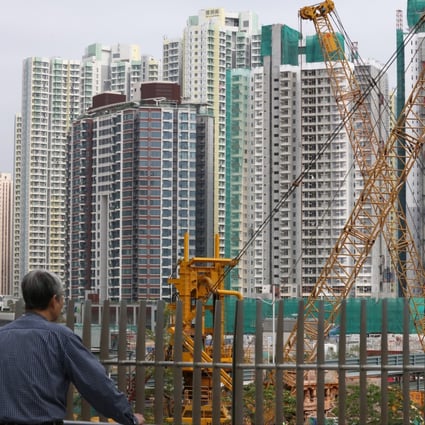 A construction site and residential buildings at Tak Long Estate in Kai Tak. Photo: Felix Wong