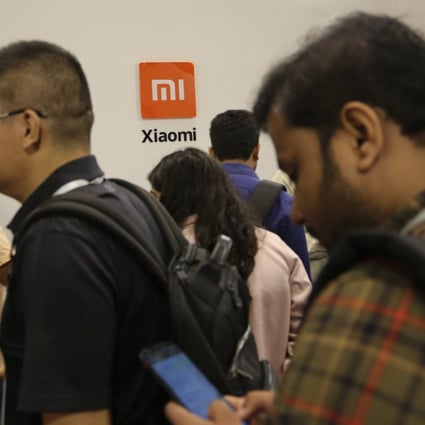 Guests gather to check out Xiaomi’s newly launched products at an event in Bangalore, India.
Photo: AP Photo 