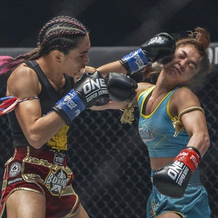 Janet Todd lands a punch on Stamp Fairtex. Photos: ONE Championship.