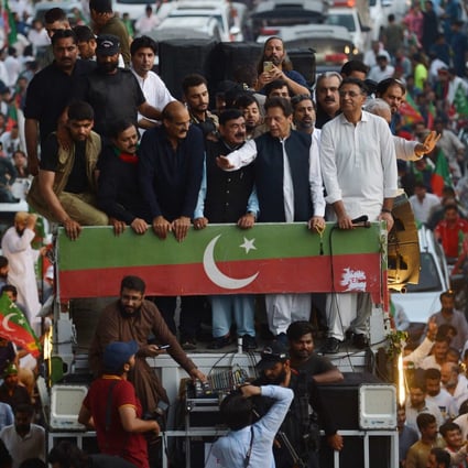 Imran Khan (second from right), former Pakistan prime minister and leader of the opposition Pakistan Tehreek-e-Insaf party, waves to supporters during an anti-government protest in Rawalpindi on July 2. Photo: AFP