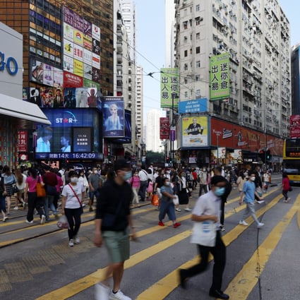 Pedestrians in the shopping hub of Causeway Bay. Hong Kong’s growth has been stunted by tough Covid measures. Photo: Nora Tam