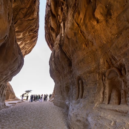 Tourists visit the Nabataean archaeological site of al-Hijr (Hegra), near the northwestern Saudi city of al-Ula. Saudi Arabia is hoping to woo visitors travelling to nearby Qatar for soccer’s World Cup. Photo: AFP