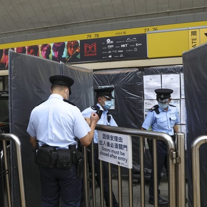 Police officers enter Hong Kong Coliseum on Friday, a day after a video screen collapsed onto the stage, injuring two workers. Photo: Yik Yeung -man