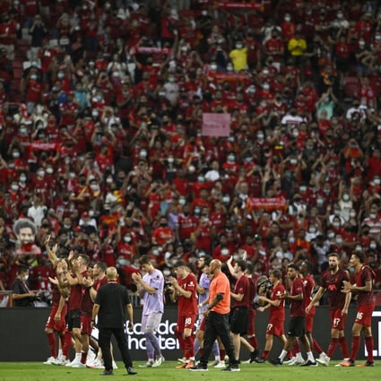 Liverpool players applaud fans after a match at the National Stadium in Singapore on July 15. A similar international sporting event is unthinkable in Hong Kong, under the current administration’s pandemic policy. Photo: Reuters 